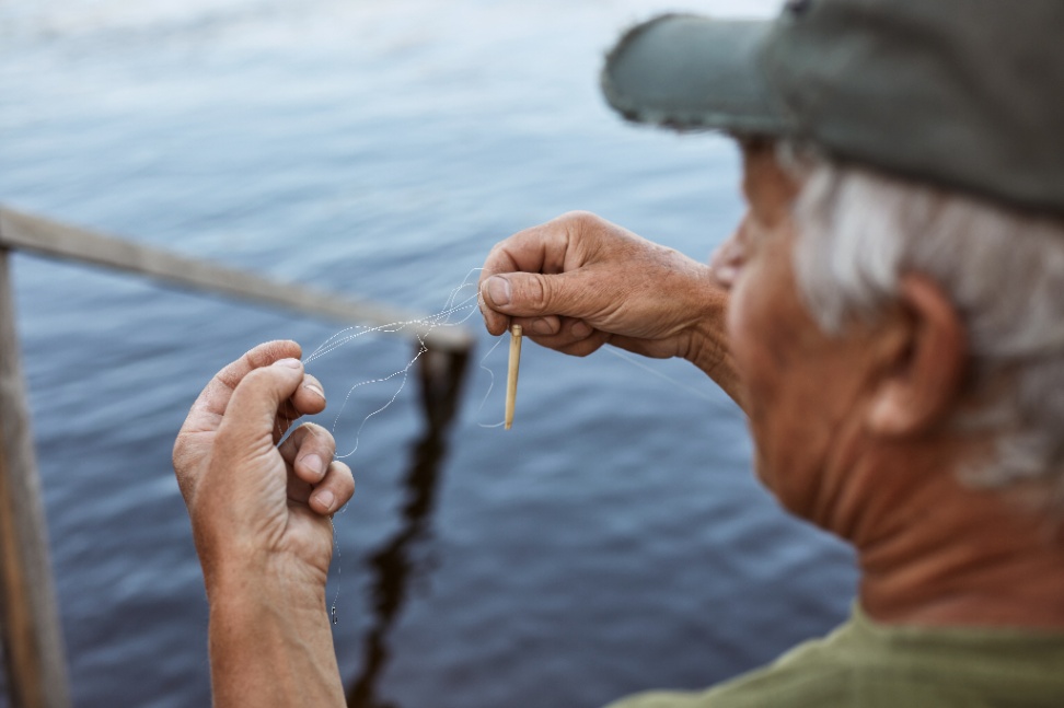 compressed-senior-man-with-grey-hair-wearing-baseball-cap-green-t-shirt-baits-fishing-rod-elderly-male-spending-time-near-river-lake-having-rest-open-air